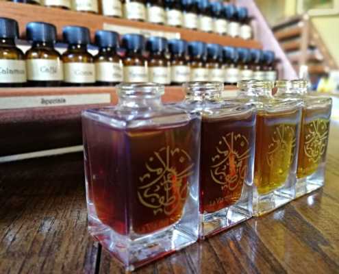 open-perfume-bottles-and-organ